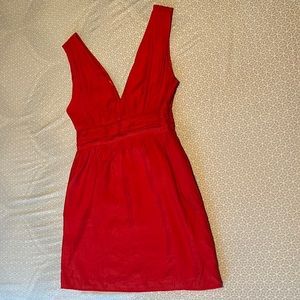 Short Red Paraella Dress with low v-neck and bow on back.